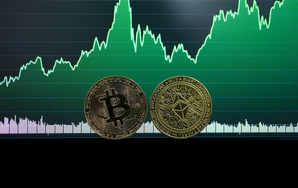 bitcoin in front of a rising green chart